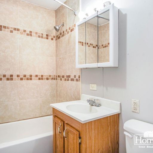 Building Photo - Charming two-bedroom, one-bath home offering a comfortable layout with ample natural light