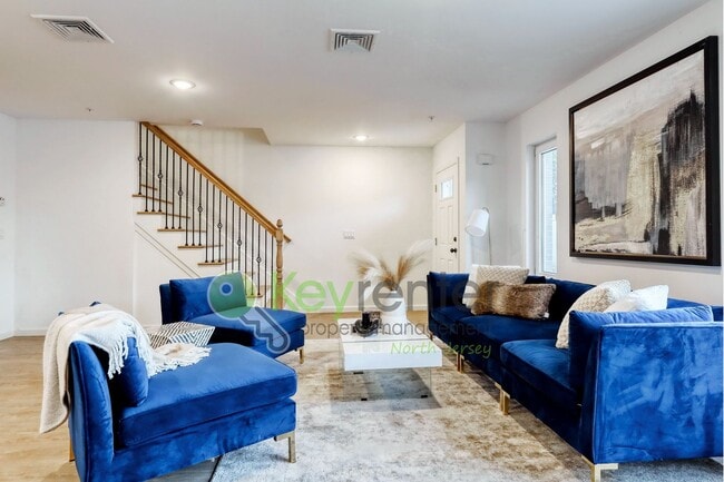 Building Photo - Modern New Construction 2 Bedroom Townhome with Garage & Driveway — First Occupancy!