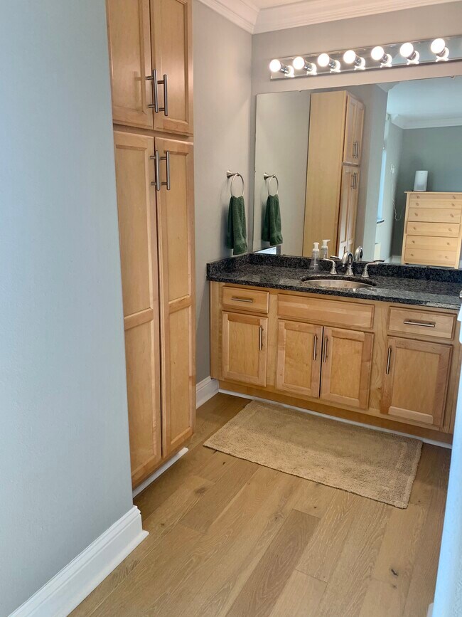 En suite bathroom with separate room for shower and toilet. - 700 E 8th St