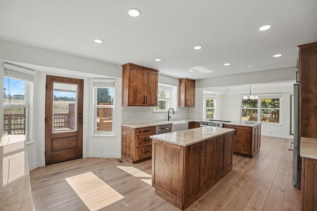 Building Photo - Backs to Open Space | Over 4,000 Sq Ft | Updated Kitchen + Solar