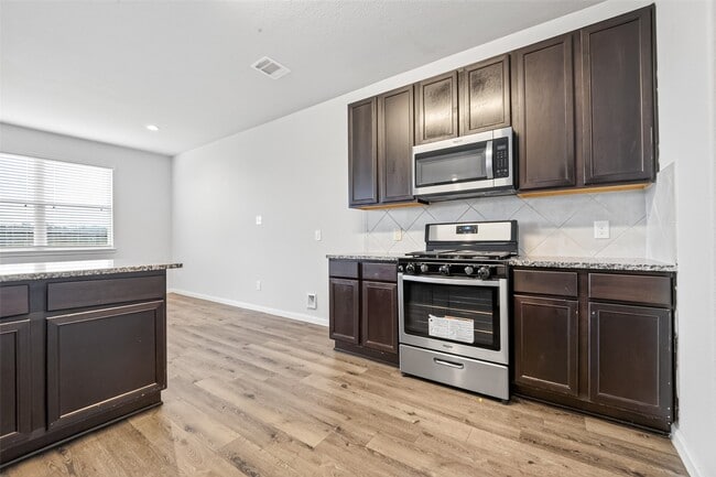 Building Photo - 4818 Blue Jacaranda Wy