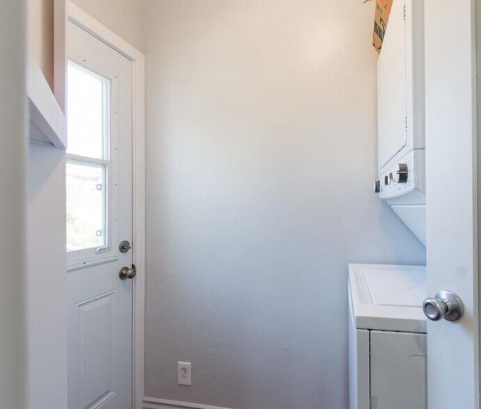 View from kitchen. Additional laundry room door with window is an upstairs egress - 1733 Phillips Way