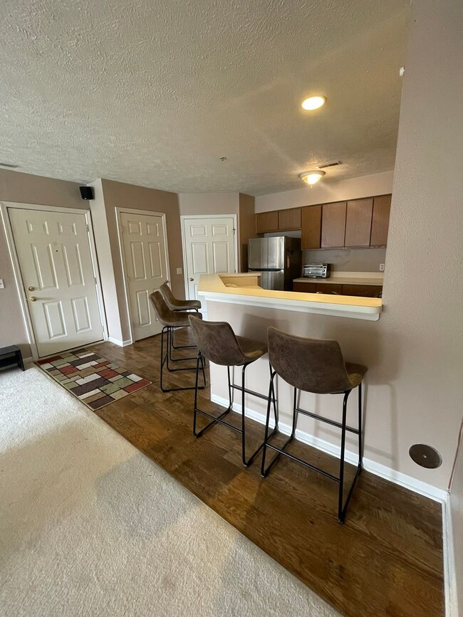 Building Photo - 2 Bed + Office Condo | Pool, Garage & Flexible Move-In