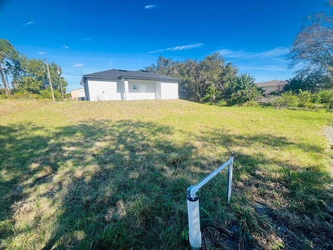 Building Photo - Brand New 2/2/1 -SW Lehigh Acres