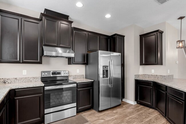 Building Photo - Spacious, Nearly New and Gated 3/2.5/2 Plu...