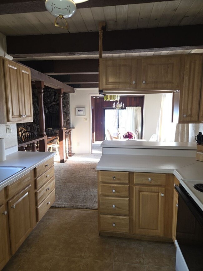 Building Photo - Unique open design,wood beams in all rooms-Very cheery and cozy. Newly remodeled, and newly furni...