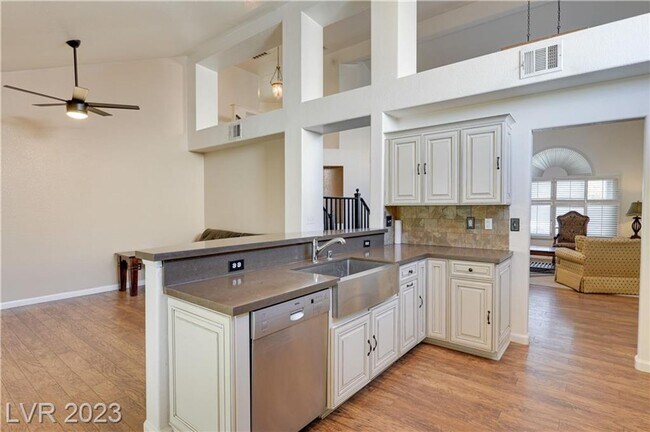 Building Photo - 4 BEDROOM HOME WITH PRIMARY BEDROOM DOWNST...