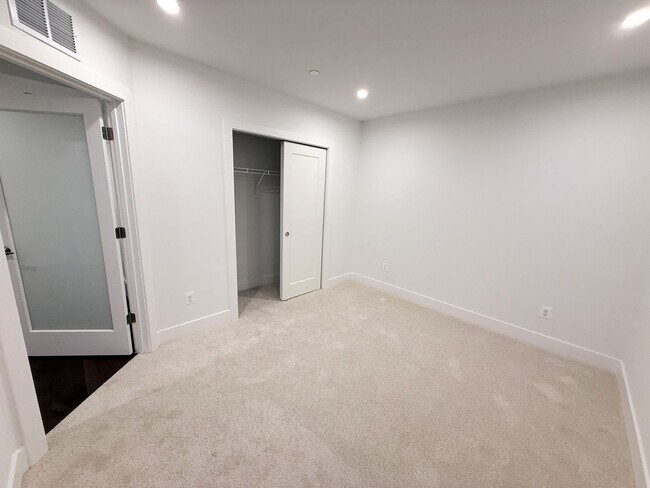 Building Photo - Brand new 4 level, 4 Bedroom Townhome with Elevator!