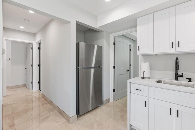 Hallway to bedroom and door to in unit washer & dryer - 6038 W 75th St
