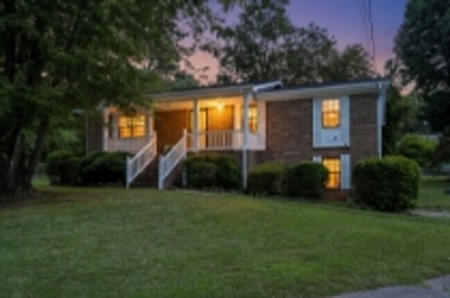 Building Photo - This beautifully updated brick home in Har...