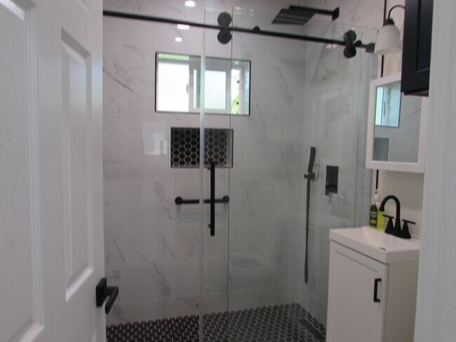 Building Photo - 2bed/1 bath ADU--NEW--Private with wrap around patio/yard Washer/Dryer included!