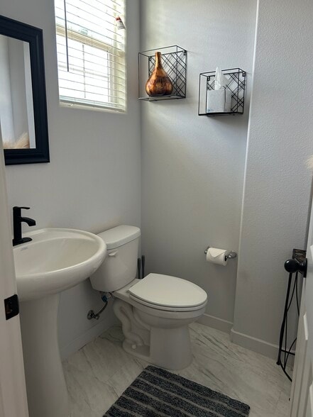 Half bathroom downstairs - 6757 Jujube Ln
