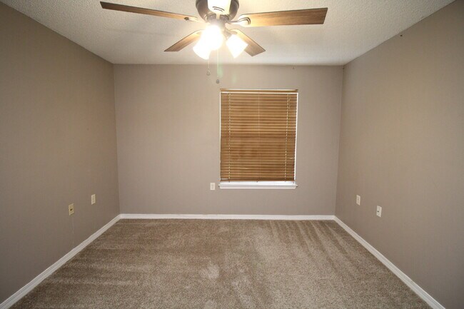 Building Photo - 2BR Patio Home with LVP Flooring, Private Fenced Yard, & Convenient Blue Angel Pkwy Location Near...