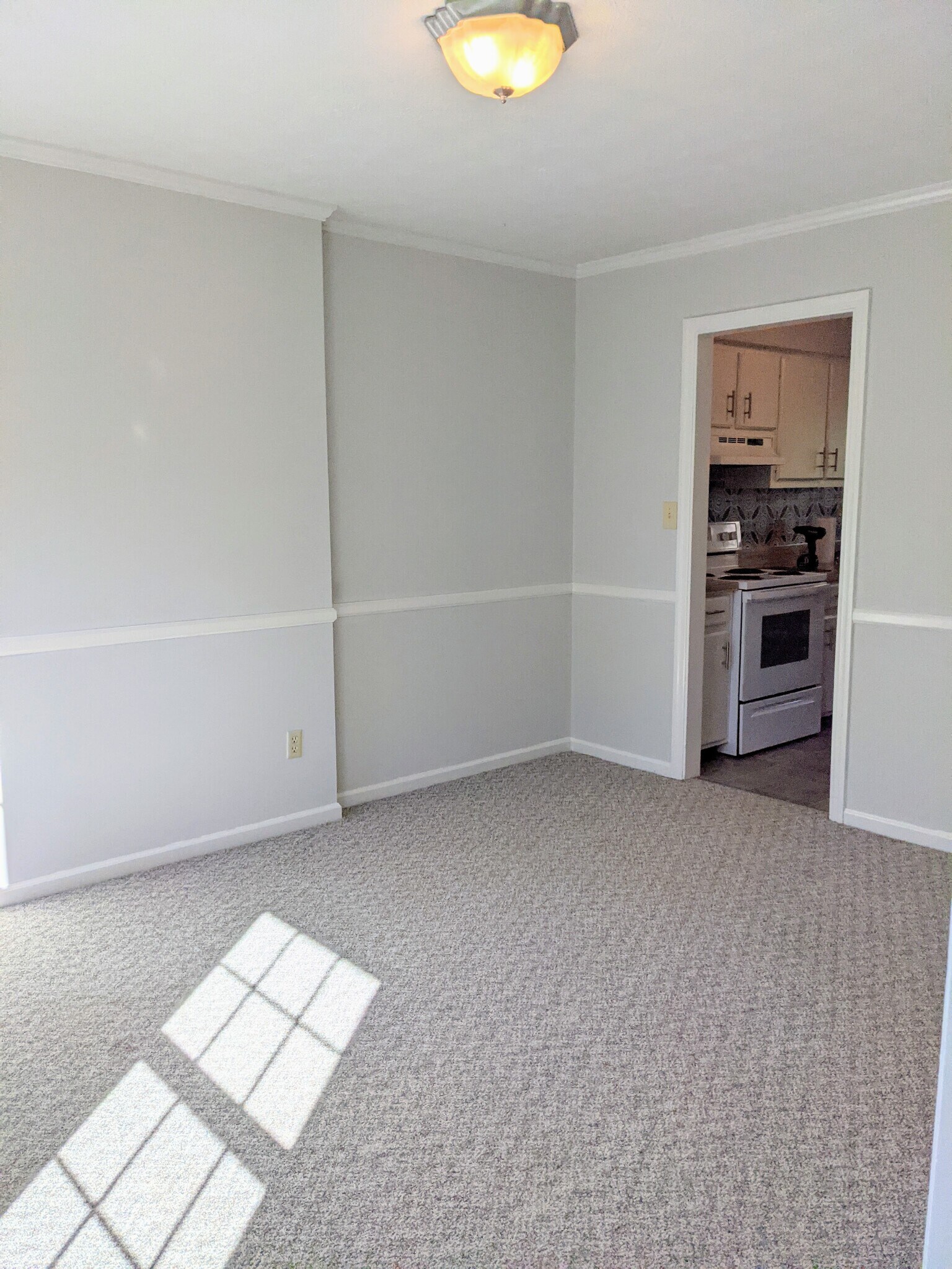 Left front room looking towards rear of home to kitchen - 3221 Hunters Point Dr