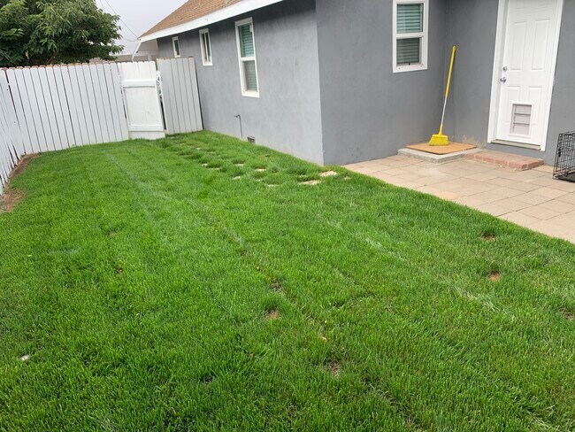 Gated Back yard with storage access. - 428 Hamilton St