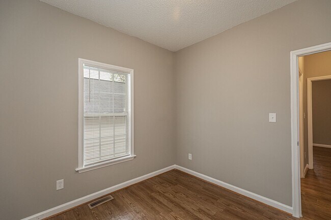 Building Photo - Like New Home off Freeman Mill.  Just Painted, New Wood/Vinyl Flooring, Vaulted Ceilings, Front P...