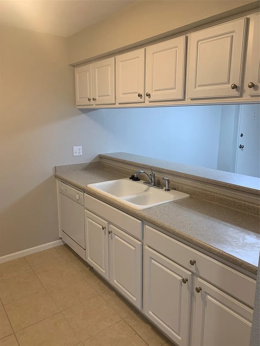 Kitchen look through to dining room. - 105 NW 8th St