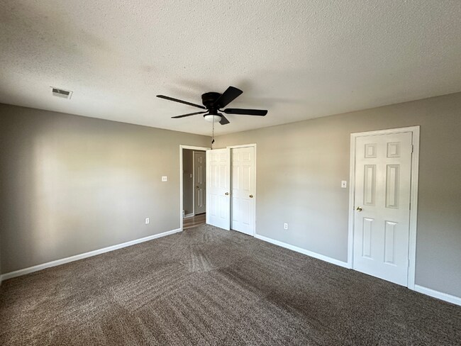 Building Photo - Charming 3BR/2BA Near Southwind | Hardwood Floors, Brick Fireplace, Bay Window & 2-Car Garage
