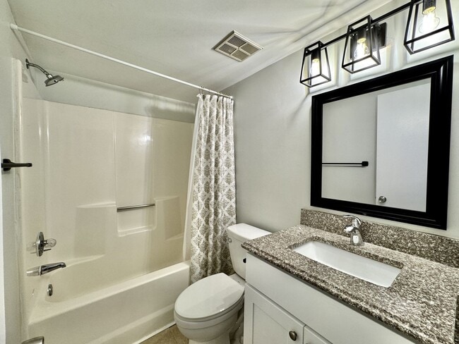 Building Photo - Just Updated & Ready NOW! A Pet Friendly H...