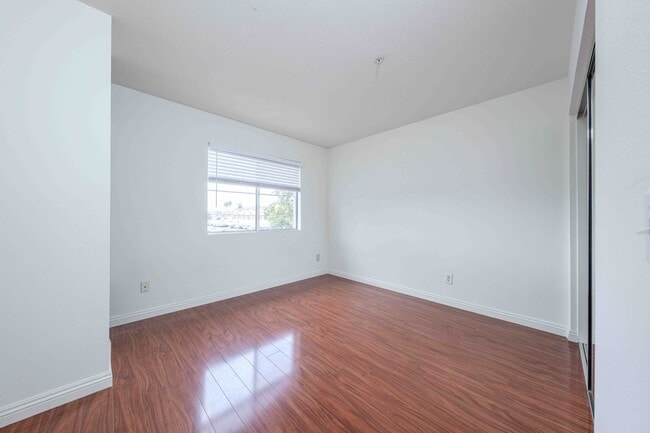 Building Photo - Gated Townhome with Updated Kitchen and Private Backyard