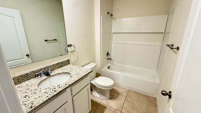 Building Photo - Available NOW! Spacious 4BD/2BA Haven in Villages at Harmony – Your Dream Home Awaits! WASHER & D...