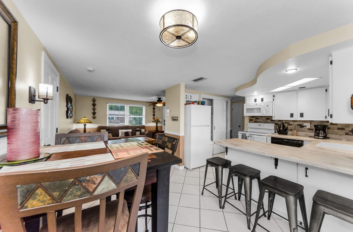 4 seating dinning table plus 4 on the kitchen counter. 4 more in Florida room. - 3931 Sail Dr