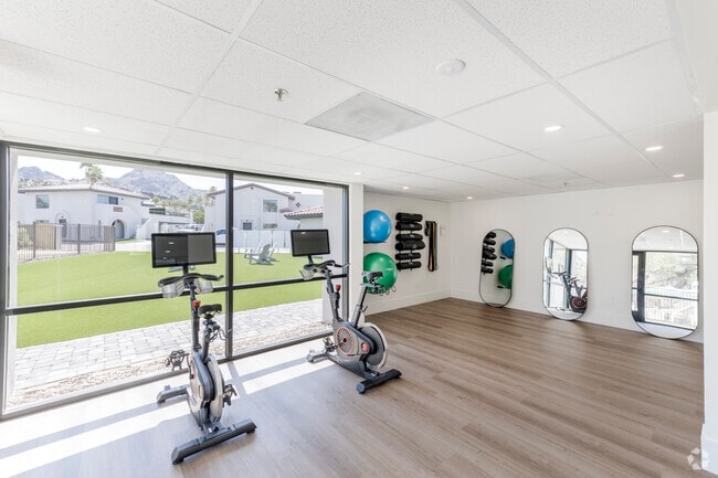 Wellness room featuring spin bikes, cardio stations and yoga/stretching areas - Views at the Peak