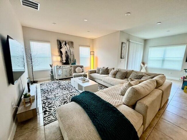 Building Photo - Open concept home offering four bedrooms, three baths, a two car garage and open lanai.