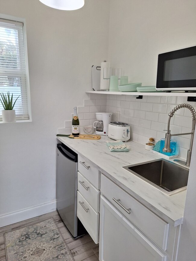 Building Photo - NSB FURNISHED EFFICIENCY UNIT-ALL UTILITIES INCLUDED INCLUDING WI-FI!