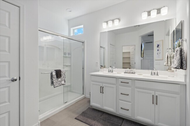 Primary Bathroom with walk-in shower and double vanity - 9014 W Oregon Ave