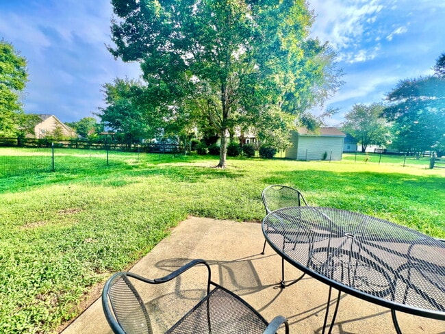 Building Photo - FENCED BACK YARD