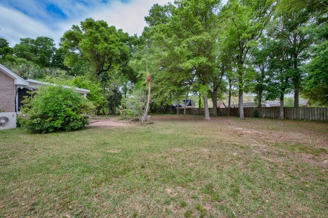 Building Photo - Spacious 3BR Retreat with Soaring Ceilings & Screened Porch