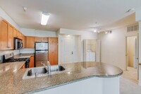 Chef inspired kitchens featuring  granite countertops - Windsor Lofts at Universal City