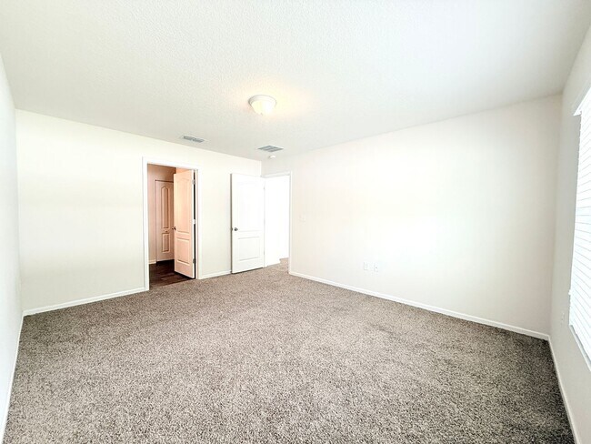 Building Photo - Spacious 4BR Home with Large Fenced Yard & Community Pool