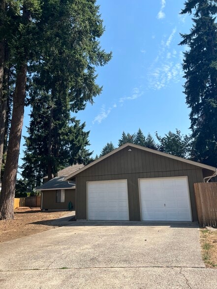 Right side parking space and garage belong to this unit - 14310 NE 14th Cir