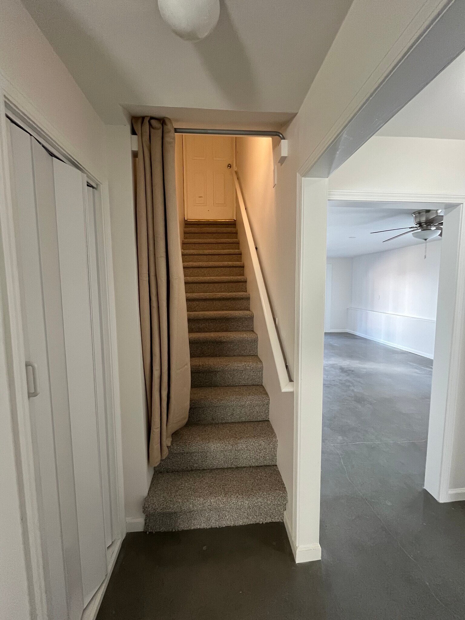 Stairway to upper level - 12 Brookside Cir