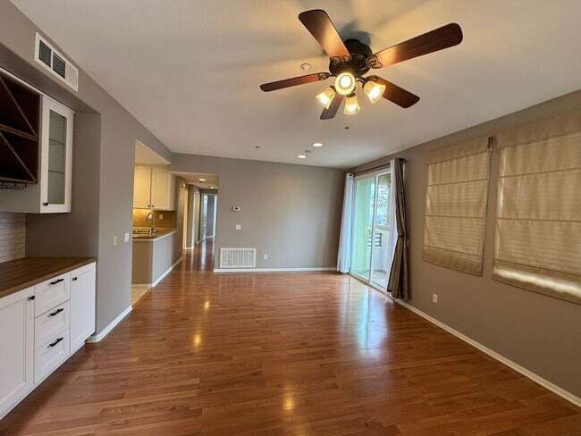 Building Photo - Sleek 2-Bed with a Den/Office + Flex Corner Condo with Attached Tandem Garage