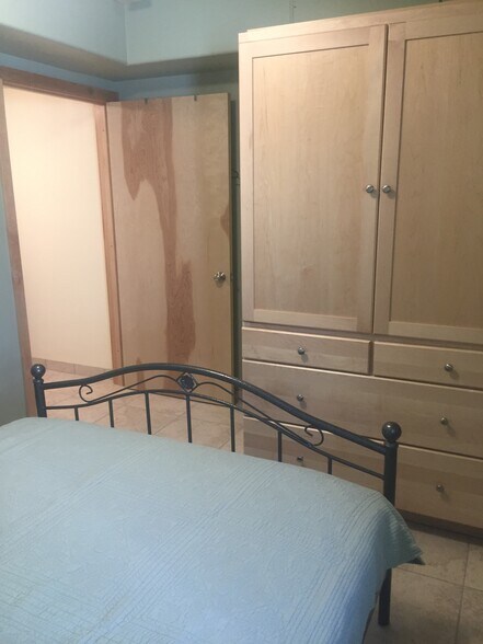 Queen bed and armoire - 108 Wilderness Dr