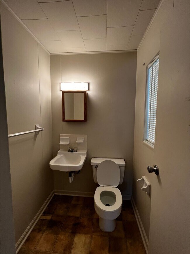 Building Photo - 3 Bedroom, 1.5 Bathroom, Brick Home with yard and Storage Building, Covered Porch