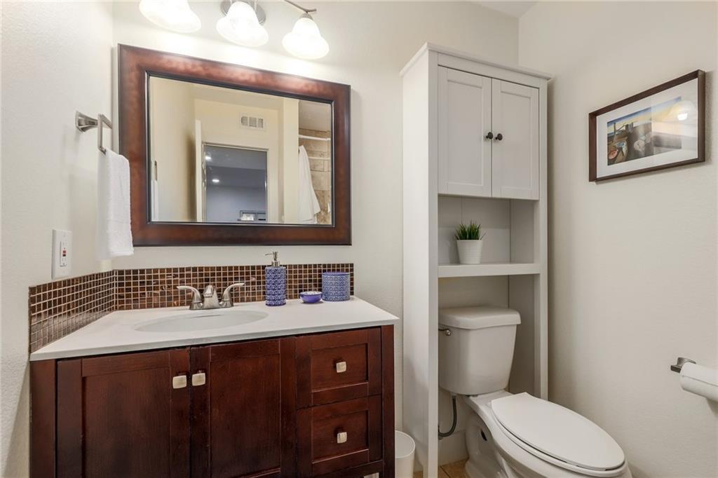 The guest bathroom provides additional storage. - 909 Reinli St