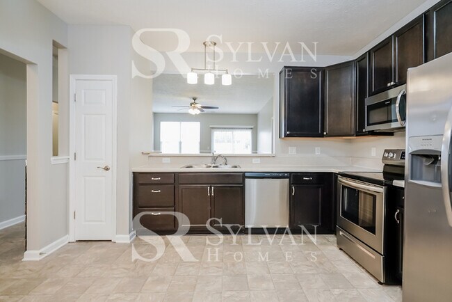 Building Photo - Turn the key. Enter. Smile. Repeat every day!