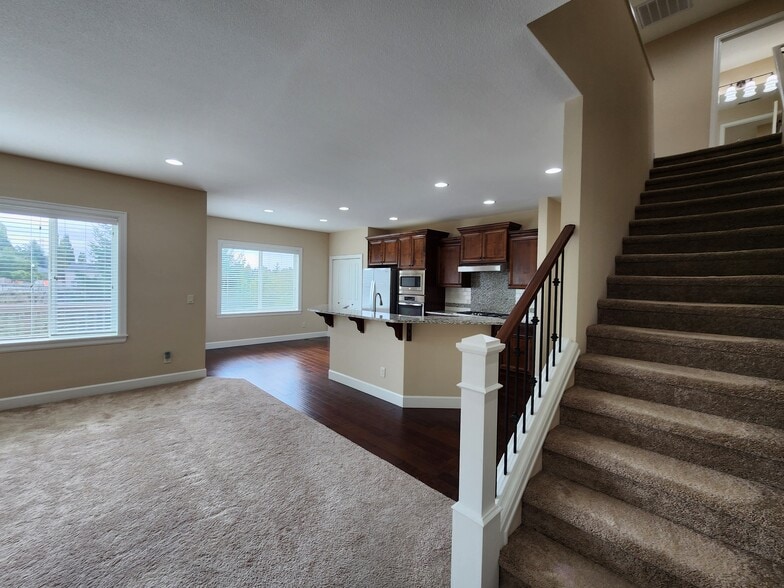 Hall and Stairs Leading to the Second Floor - 6128 NW Trowbridge Dr