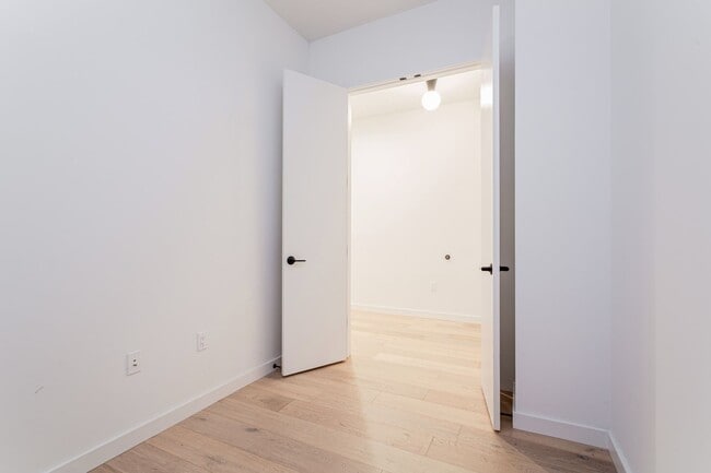 Building Photo - Light-Filled 2 Bed / 1 Bath – Wide-Plank Hardwood & W/D Included