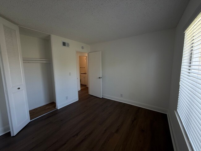 Building Photo - Recently updated home with new floors, paint & bathroom!