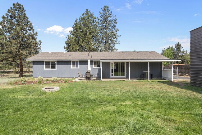 Building Photo - Charming 3-Bedroom Bend Home on 1/2 Acre with Expansive Yard, Mature Trees & Covered RV/Boat Storage