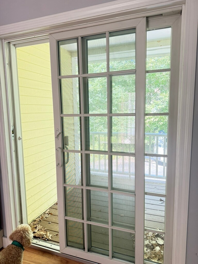 Sliders to covered balcony facing back yards woods - 20 Partridge Ln