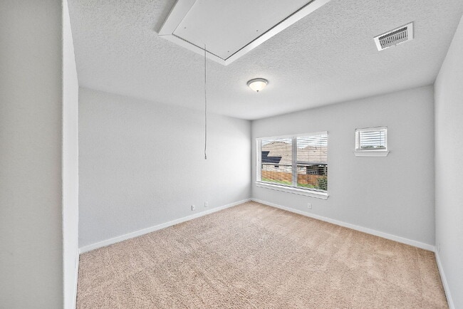 Building Photo - Greenbelt. 3 Car Garage. Built In Dog Room.