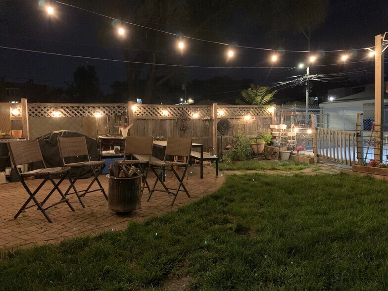 Community yard with picnic table, grill, and gardening area - 1913 N Kimball Ave