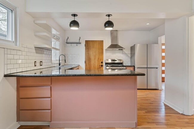 Building Photo - Beautiful, modern 4-bdrm/2-bath home in Concordia—Private, urban sanctuary w/ flex spaces