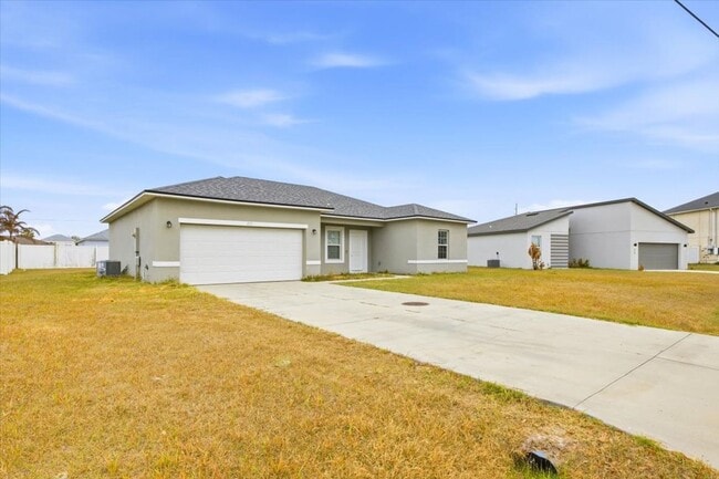 Building Photo - Stunning 4-Bedroom, 2-Bath Home in Poinciana with Modern Upgrades